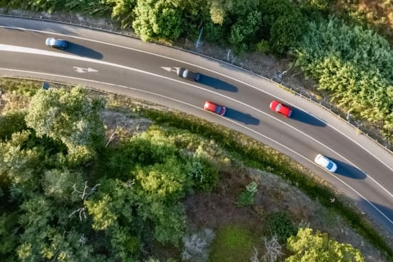 Aerial view of roadway with cars on it