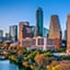 The city of Austin, Texas, with tall buildings along the Colorado River