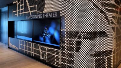  Modern wall at an Innovation Hub showing two screens in an Envisioning Theater