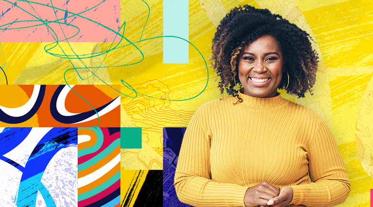 Woman smiling against a colorful background while attending the Esri User Conference