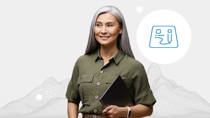 A woman with a green collared shirt holding a black laptop with an inset icon in a white circle