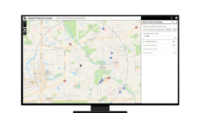 A computer monitor featuring a map that outlines a geographic area with various labeled locations and routes.