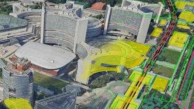 Aerial view of a convention center. Overlaid map details with yellow shading indicating buildings, green lines tracing roads and paths, and circles marking trees.